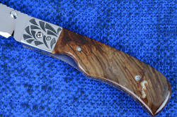 "Sadr" linerlock folding knife, obverse side handle detail. Biggs Jasper gemstone is very hard and tough, with beautiful patterns in browns and crystal