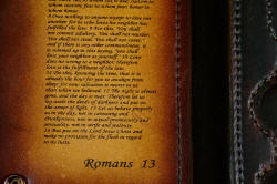 "Steak Knives," inside case showing pockets with knives, Romans 13 verse inside cover in engraved leather shoulder.