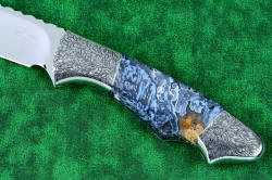 "Thuban" fine custom handmade knife, obverse side handle detail. This is a 3x enlargement, illustrating the high detail of the bolster engraving