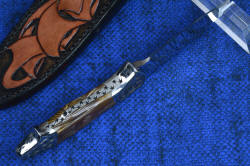 "Thuban" inside handle tang view. Note book matching scales in tree ring pattern of petrified wood handle scales