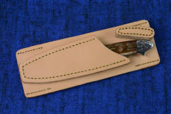 "Thuban" PSD Drop-lock horizontal sheath. Worn behind the back, the knife is prevented from moving with a long tab of leather that prohibits raising and unlocking it from sheath