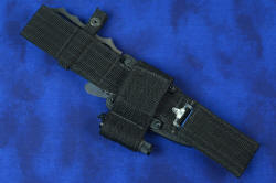 "Velox" counterterrorism tactical knife, mounted on UBLX extender, back side view showing sharpener pocket