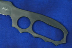 "Velox" skeletonized, D-ring, knuckle duster handle with elliptical forward finger ring.