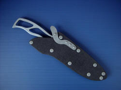 "Viper" skeletonized knife, sheathed view. Sheath has proprietary tension-locking mechanism, is made of titanium and stainless steel for high durability and is reversible