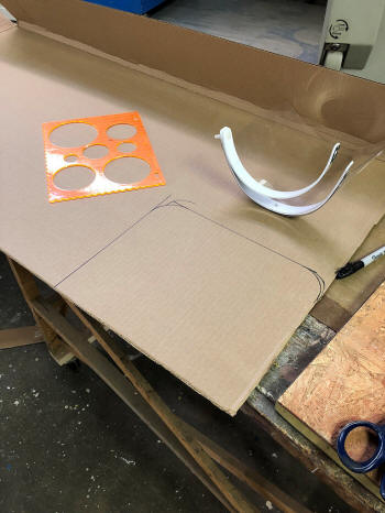Laying out cardboard face shield pattern