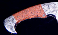Copper polishes brightly, compliments the engraved stainless steel bolsters