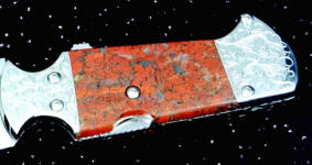 Brecciated Jasper on full tang knife with mechanism. Jasper is tough enough to support machine screw mounting!