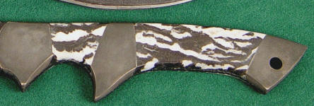 Zebra Marble on hidden tang tactical knife with central sub-hilt bolster in blued steel