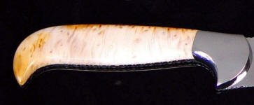 White petrified palm wood is agate and jasper, very hard and tough, and takes a bright, glassy polish