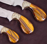 Tiger eye quartz makes striking, beautiful full tang knife handles like this set, on palm shaped handles