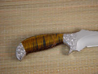 Bicolored tiger eye quartz is tough and durable on this full tang tactical art knife handle