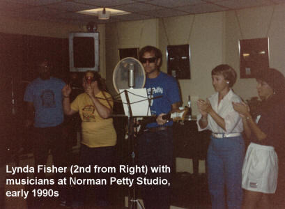 Lynda Fisher sings and claps with musicians visiting the Norman Petty Studio in the 1990s