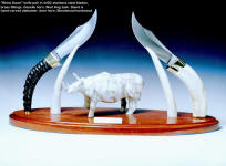 "Rhino Dawn" stand is hand-carved alabaster, bloodwood, staghorn, knife handles are gazelle horn, wart hog tusk