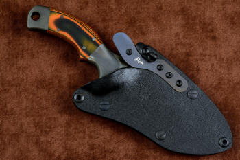 "Krag" tactical, counterterrorism, crossover knife, obverse side view in T4 cryogenically treated 440C high chromium martensitic stainless steel blade, 304 stainless steel bolsters, Orange and Black  G10 fiberglass/epoxy composite handle, hybrid tension tab-locking sheath in kydex, anodized aluminum, black oxide stainless steel and anodized titanium