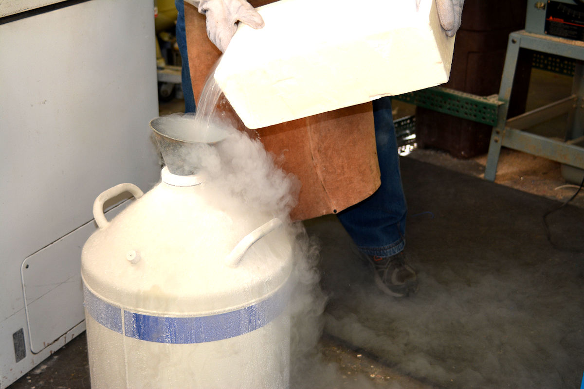 Post processing evaporation and usage rate is determined by weighing residual liquid nitrogen in a container. Here you can see the dramatic coldness of this liquid as it is returned to the Dewar Cryostat