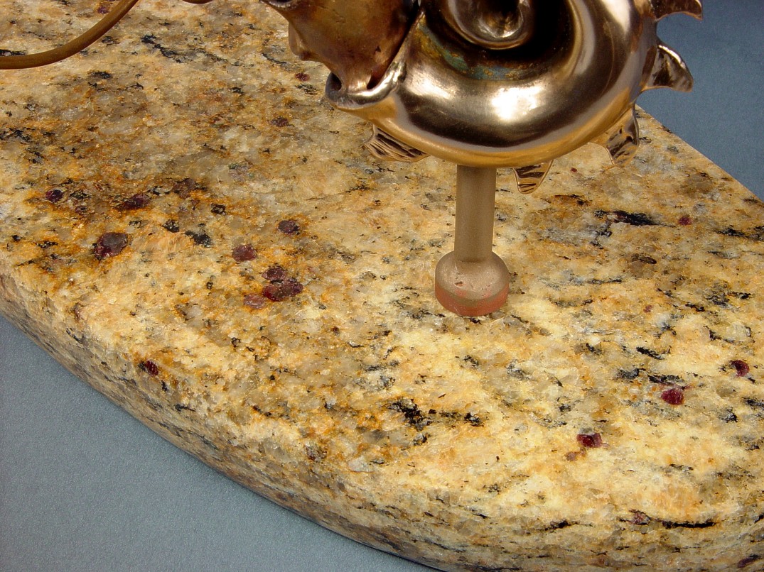 Venetian Gold Granite resembles beach sand, with hard ruby-red garnets throughout