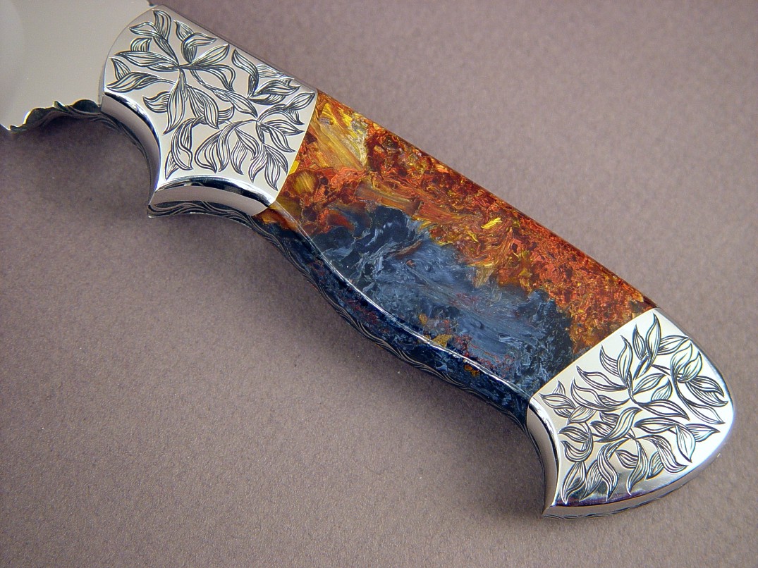 "Altair" obverse side view: CPM154CM stainless steel blade, hand-engraved 304 stainless steel bolsters, Pietersite gemstone handle, Frog skin inlaid in hand-carved leather sheath