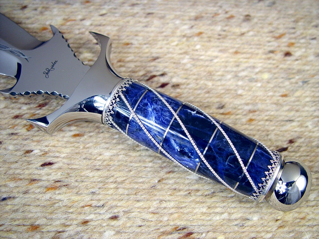 302 stainless steel sculpted guard and pommel, wire wrapped Sodalite gemstone handle with sterling silver wire, ferrules