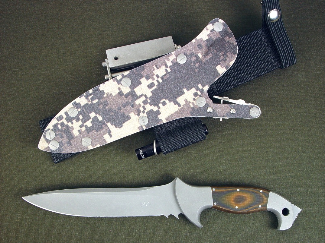 "Anzu" fine combat, tactical knife, obverse side view in CPMS30V high vanadium tool steel blade, 304 stainless steel bolsters, Tiger Stripe G10 fiberglass epoxy laminate composite handle, digi-camo desert kydex locking sheath with ultimate extender package and accessories