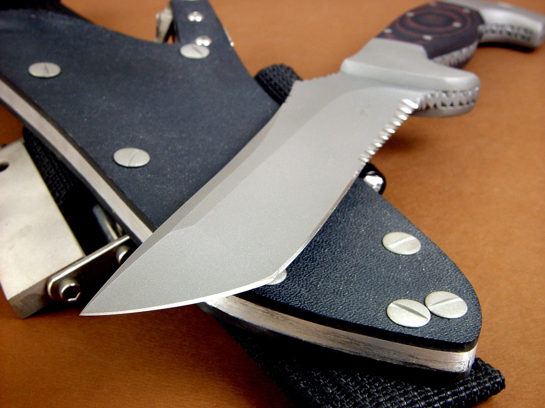 "Arctica" obverse side view in ATS-34 high molybdenum stainless steel blade, 304 stainless steel bolsters, red/black G10 fiberglass epoxy composite handle, locking kydex, aluminum, stainless steel sheath with full accessory package