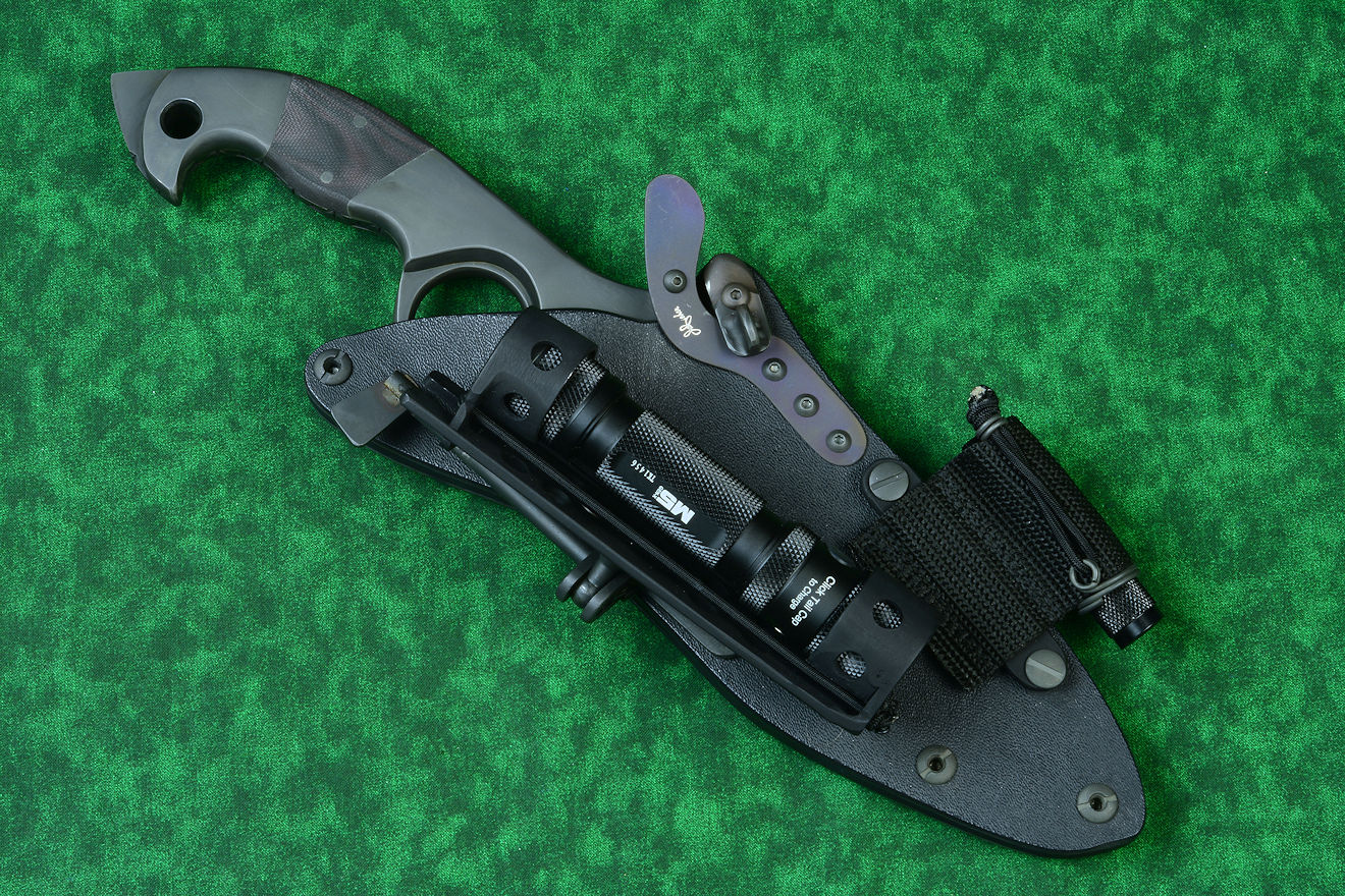 LIMA mounted (with HULA) on counterterrorism knife below dogleg spring of hybrid tension tab-lock sheath