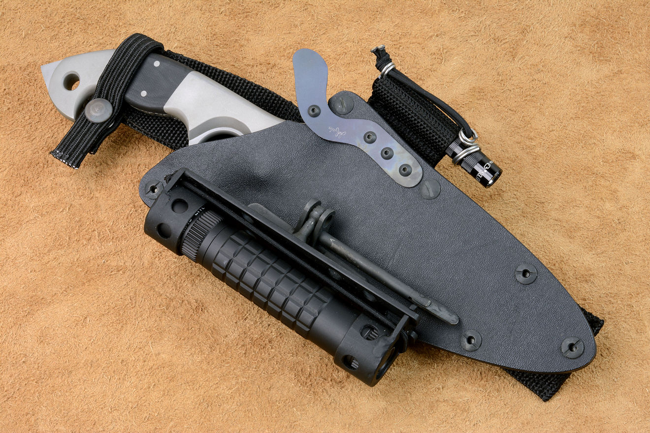 "Ari B'Lilah" counterterrorism, combat knife, in ATS-34 high molybdenum stainless steel blade, 304 stainless steel bolsters, G10 fiberglass/epoxy composite handle, hybrid tension-locking sheath in kydex, anodized aluminum, stainless steel, HULA, UBLX in polypropylene, polyester