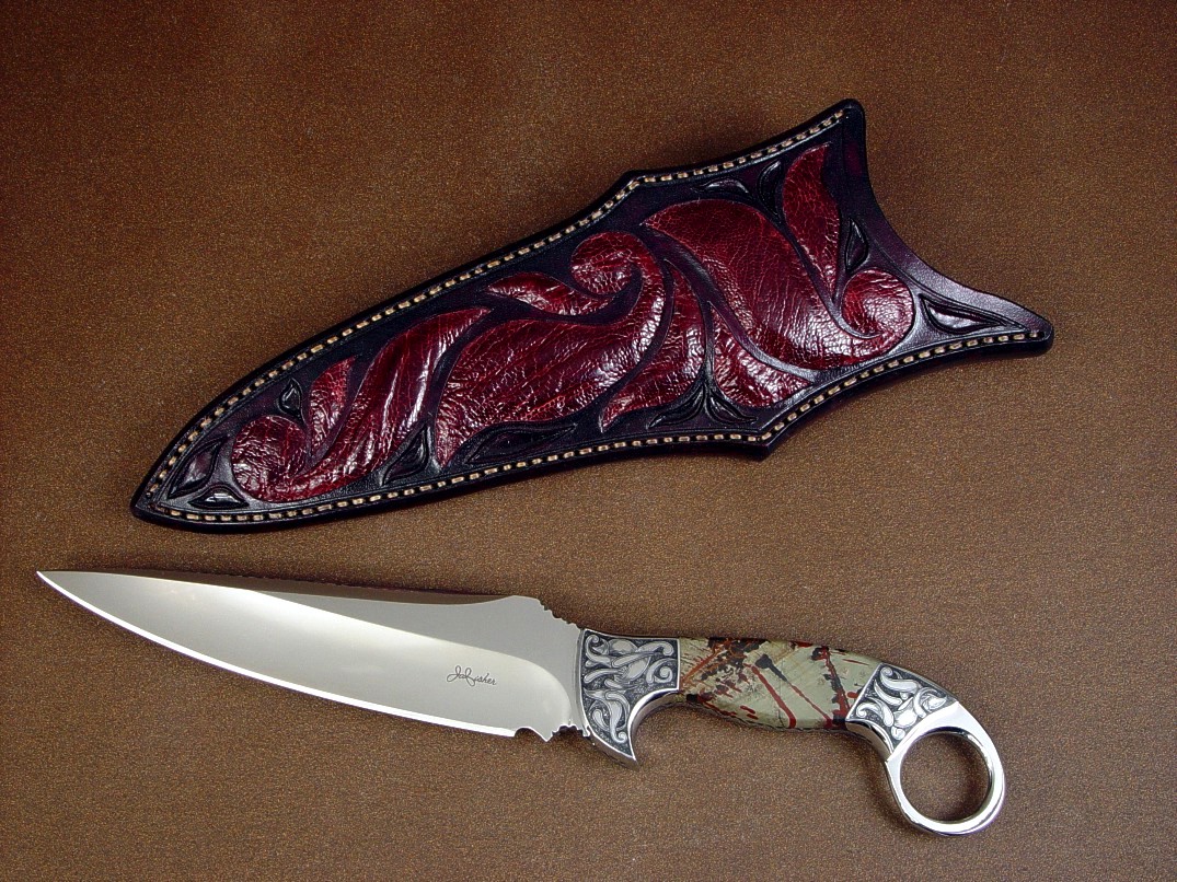 "Bulldog" fine tactical, art knife, obverse side view in 440C high chromium stainless steel blade, hand-engraved 304 stainless steel bolsters, Indian Paint Rock gemstone handle, ostrich leg skin inlaid in hand-carved leather sheath
