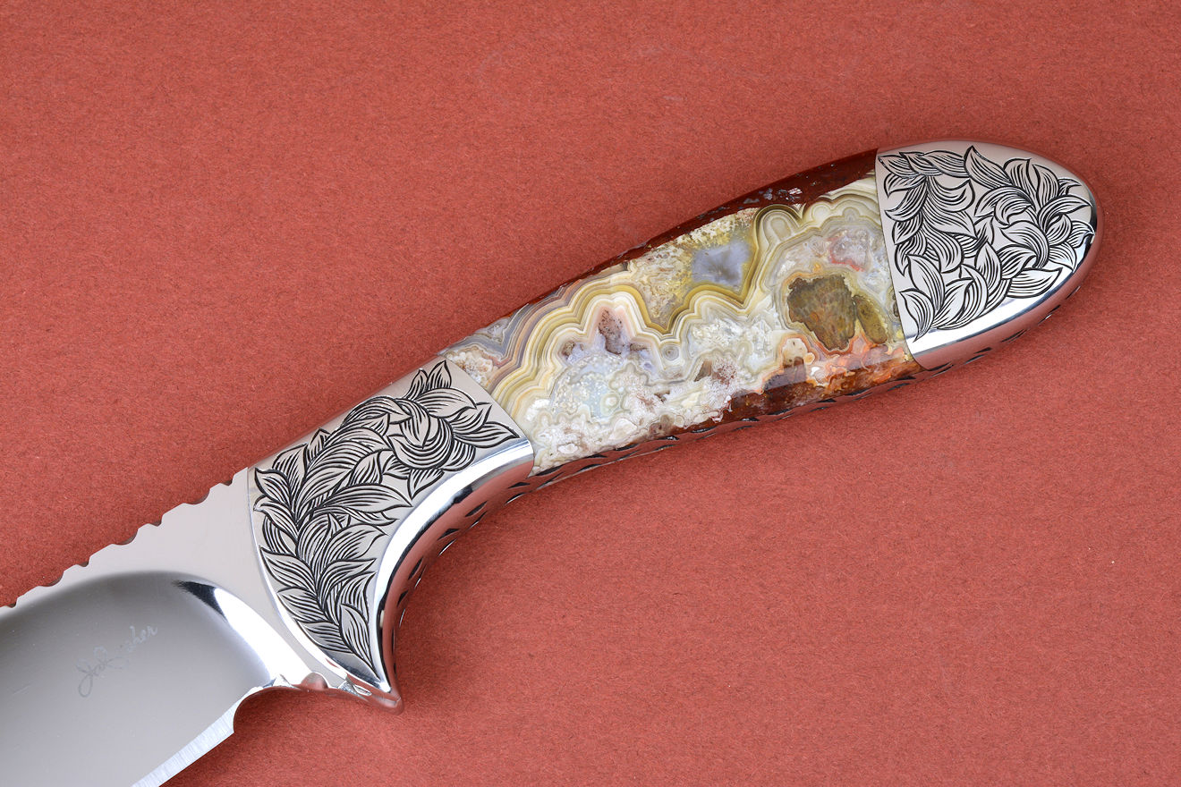 "Chicoma" obverse side view in 440C high chromium stainless steel blade, hand-engraved 304 stainless steel bolsters, Carnival Crazy Lace Agate gemstone  handle, hand-carved, hand-dyed leather sheath