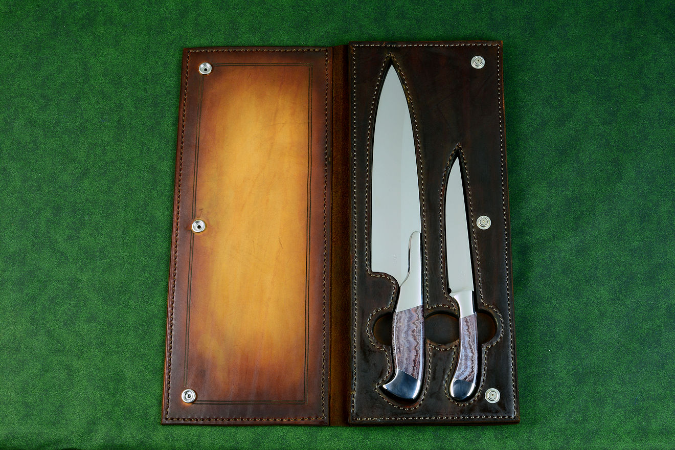 Concordia and Sanchez Chef's knives, obverse side view in T3 cryogenically treated 440C high chromium stainless steel blades, 304 stainless steel bolsters, Lace Amethyst gemstone handles, leather book case with top grain cover