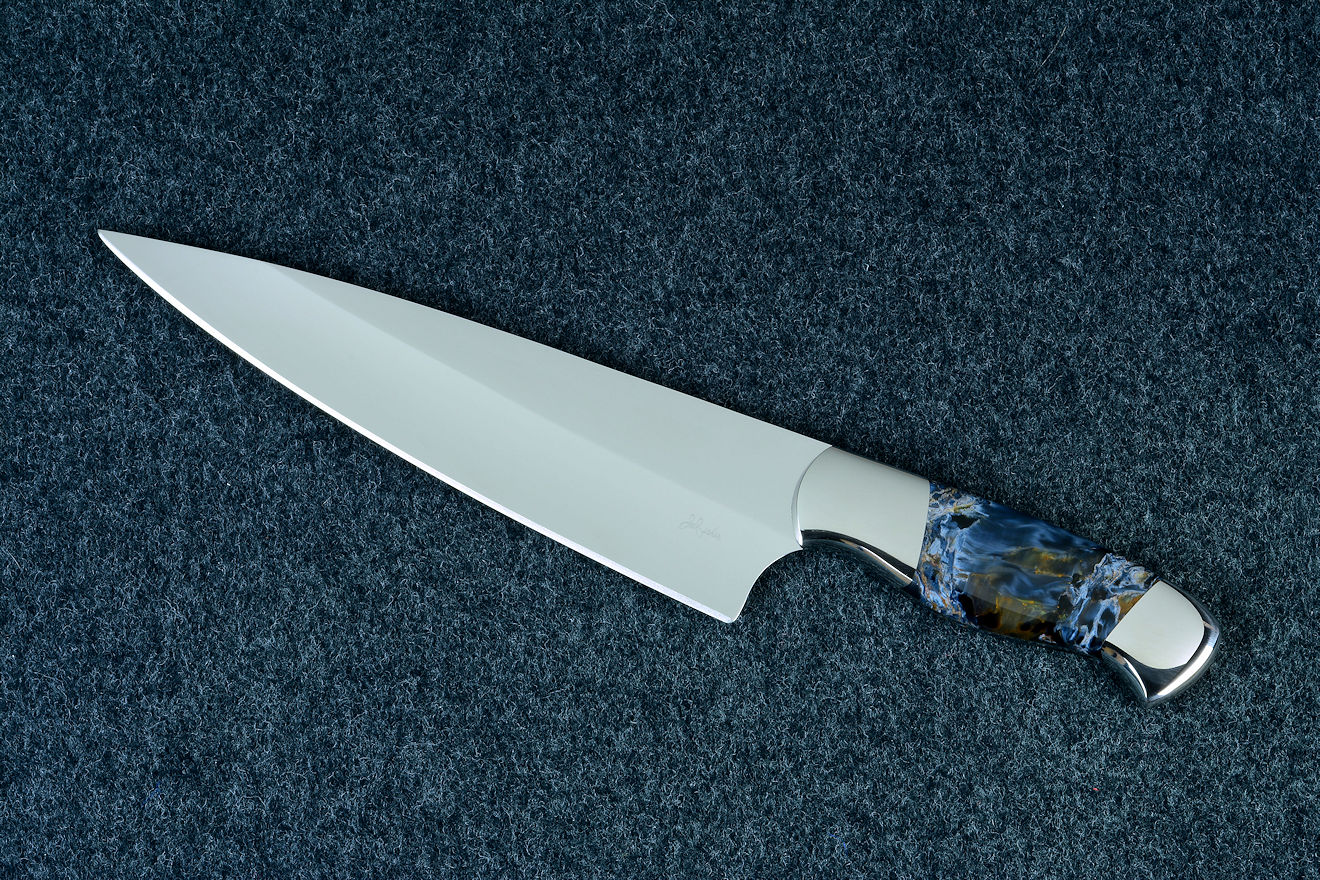 "Corvus" chef's knife, obverse side view in ATS-34 high molybdenum alloy stainless steel blade, 304 stainless steel bolsters, Pietersite gemstone handle