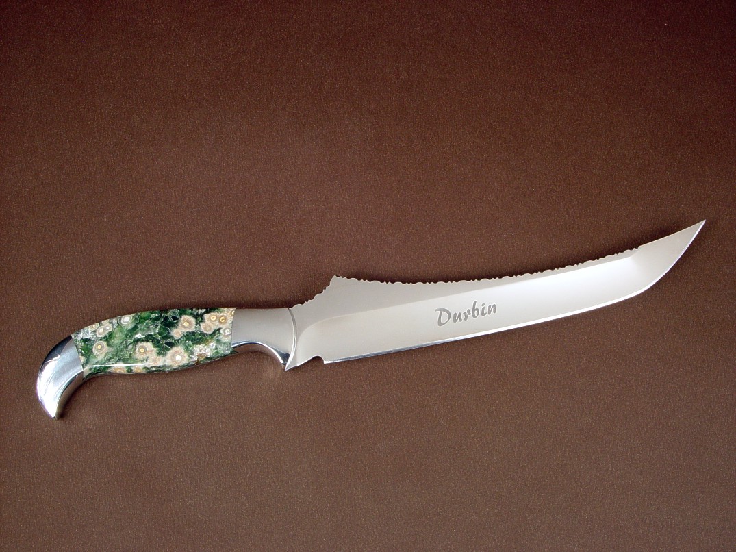 "Dagon" fillet, boning, carving, chef's, collector's; knife, obverse side view in 440C high chromium stainless steel blade, 304 stainless steel bolsters, Green Orbicular Jasper gemstone handle, frog skin inlaid in hand-carved leather sheath