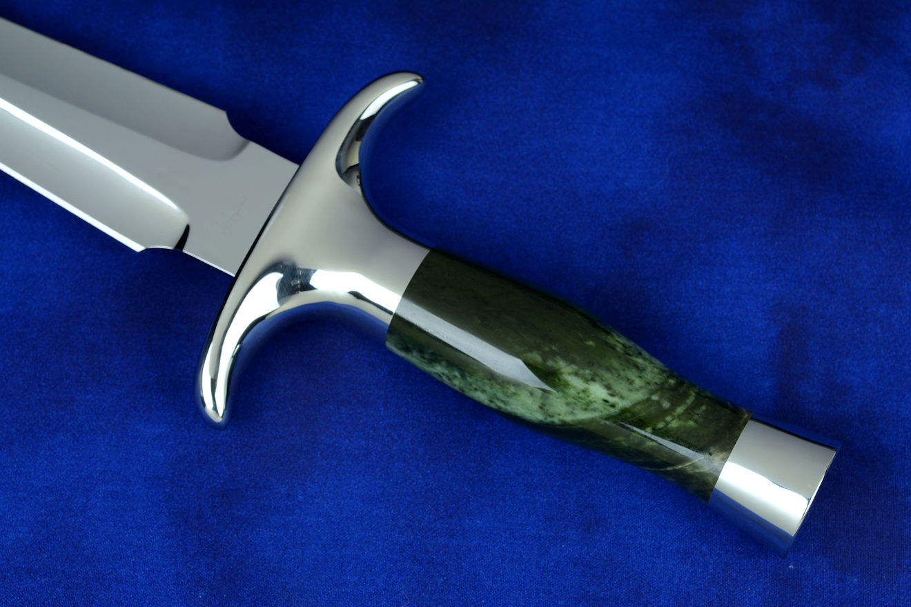 "Daqar" dagger, obverse side view in CPM154CM powder metal technology stainless steel blade, 304 stainless steel guard and pommel, Nephrite Jade gemstone handle, hand-carved leather sheath inlaid with rayskin