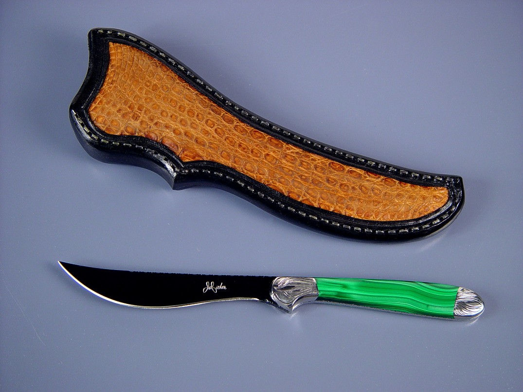 Fine handmade knife: "Kineau" obverse side view: hot blued O-1 tool steel blade, hand-engraved 304 stainless steel bolsters, Malachite gemstone handle, Caiman skin inlaid in leather sheath