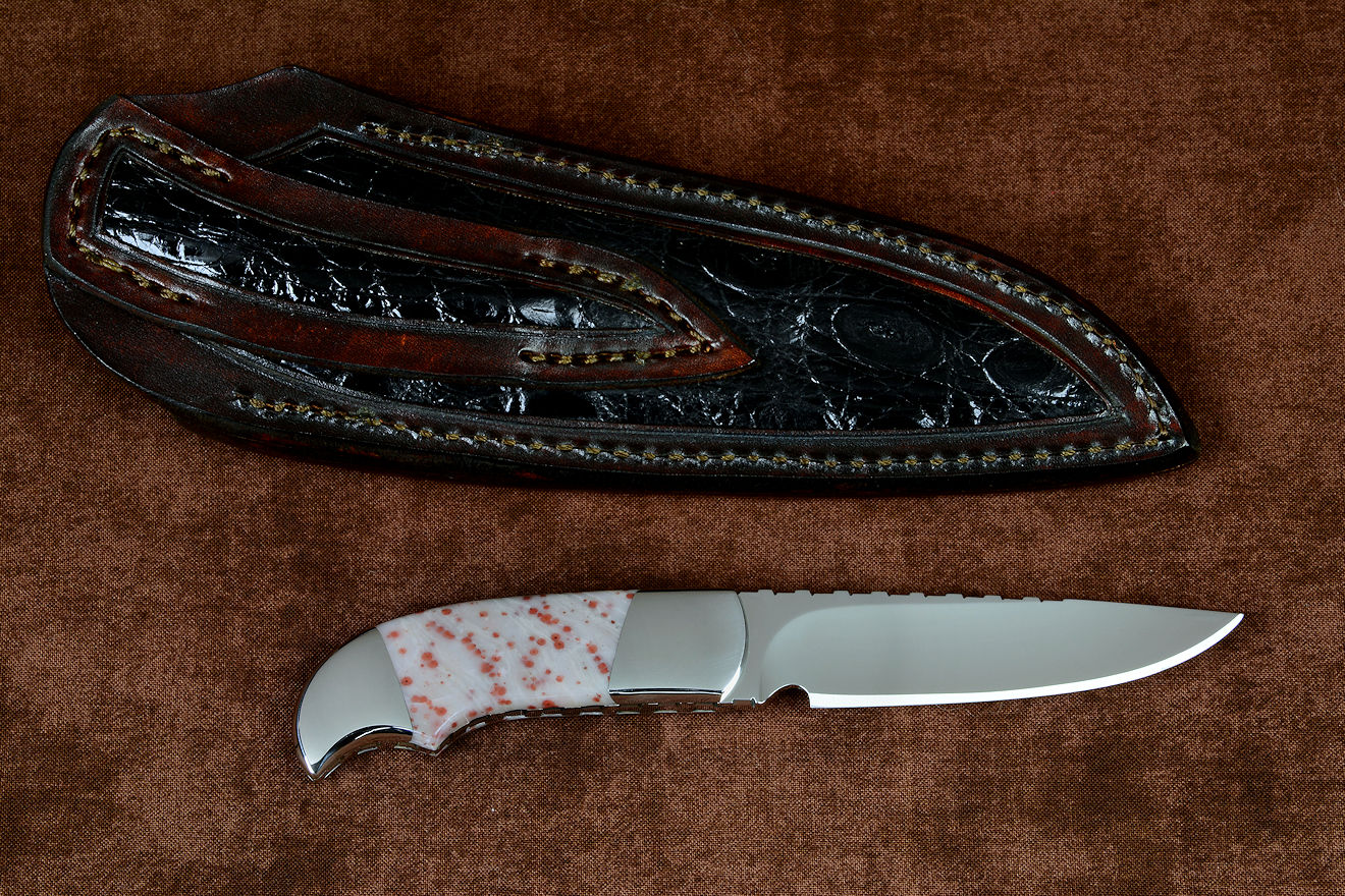 "Lacerta" fine handmade knife, reverse side view in CPM154CM powder metal technology stainless steel blade, 304 stainless steel bolsters, Red Freckled Dolomite gemstone handle, hand-carved leather sheath inlaid with Caiman skin