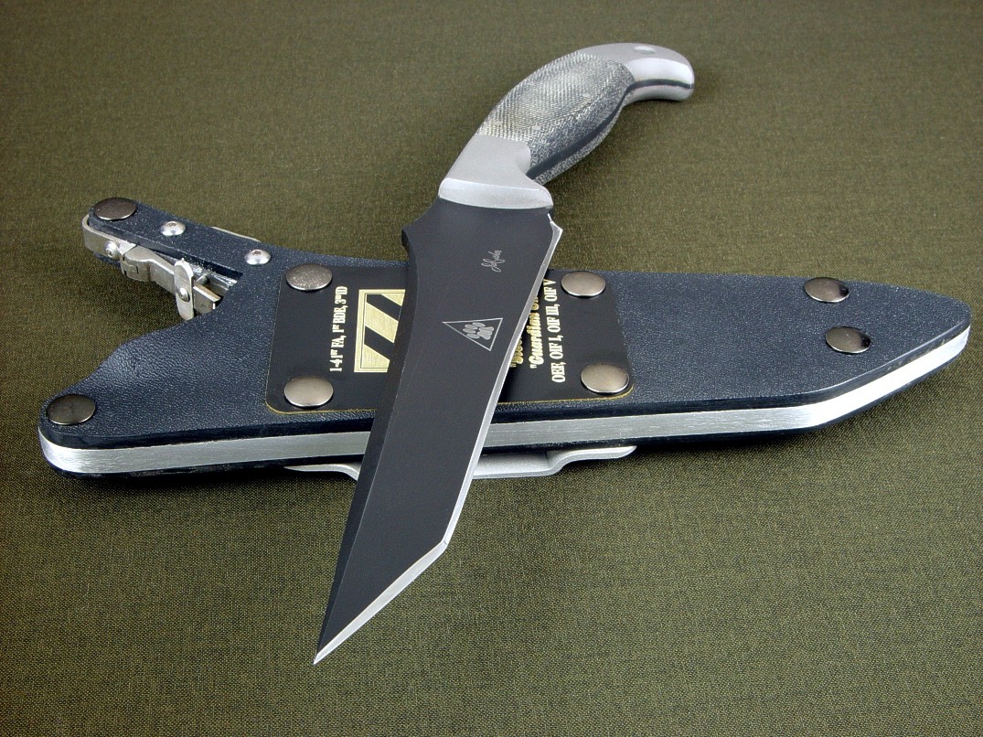 "Mercator" tactical combat knife, obverse side view in blued O1 high carbon tungsten-vanadium alloy tool steel blade, 304 stainless steel bolsters, canvas Micarta phenolic handle, locking kydex, aluminum, stainless steel sheath