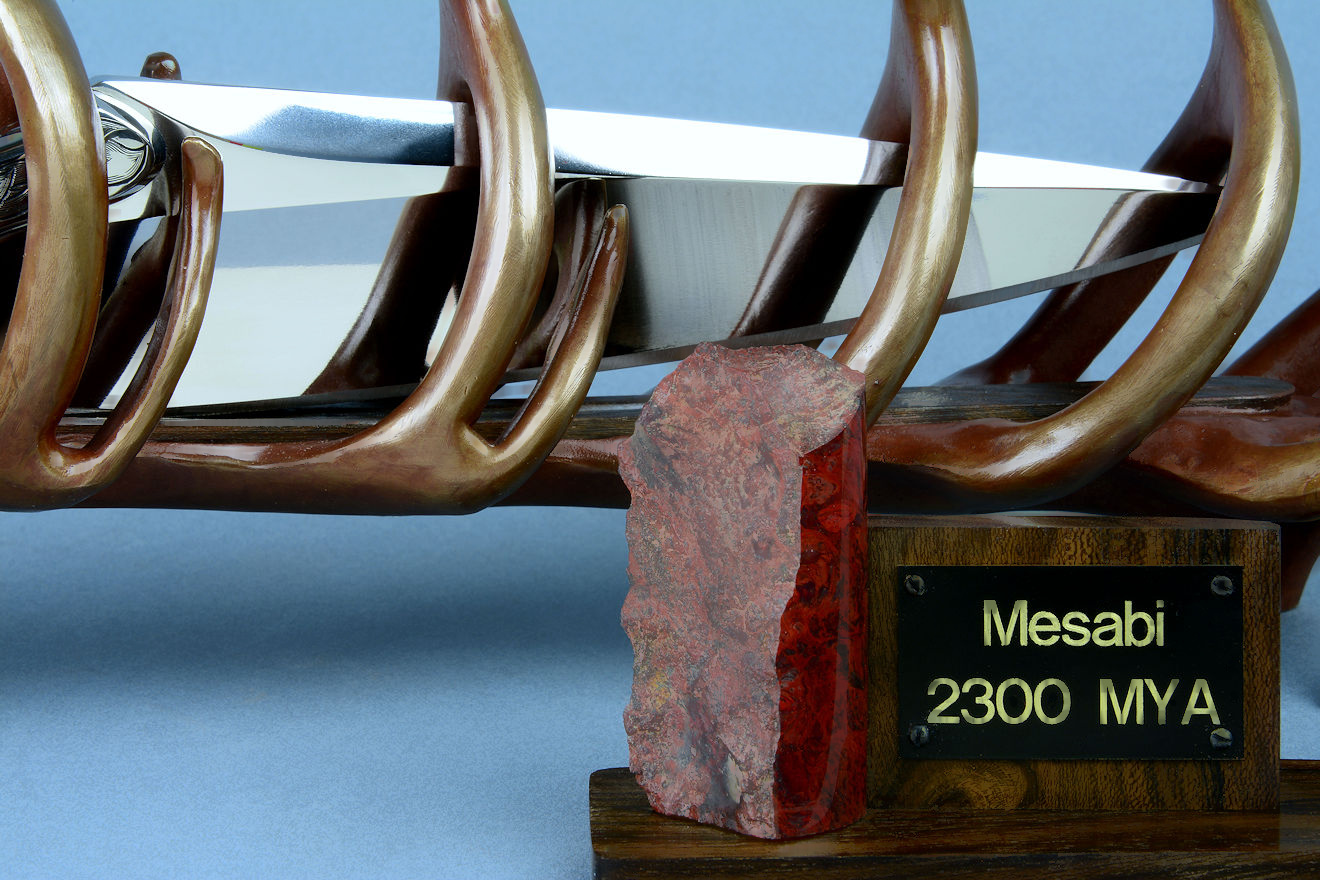 "Mesabi" custom knife sculpture in hand-cast bronze, 440C high chromium stainless steel blade, 304 hand-engraved stainless steel bolsters, Fossilized Stromatolite Chert gemstone