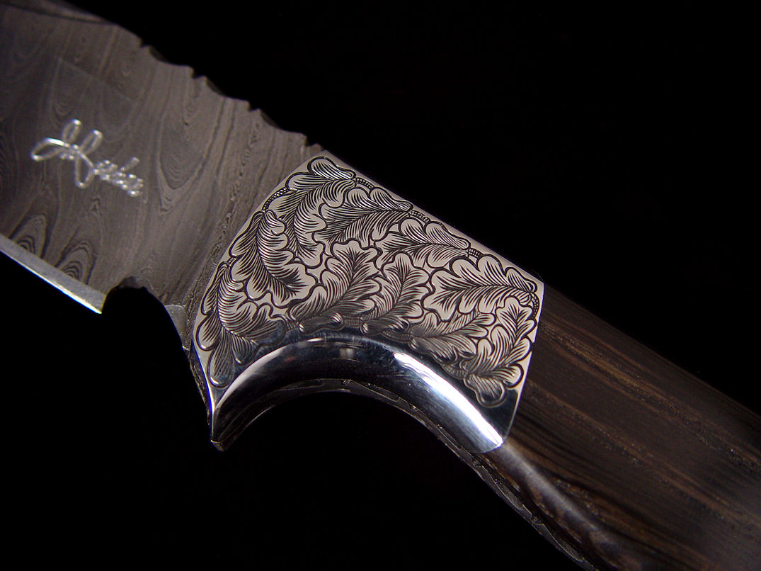 "Morta" obverse side front bolster detail. Bolsters are hand-engraved 304 high nickel, high chromium stainless steel