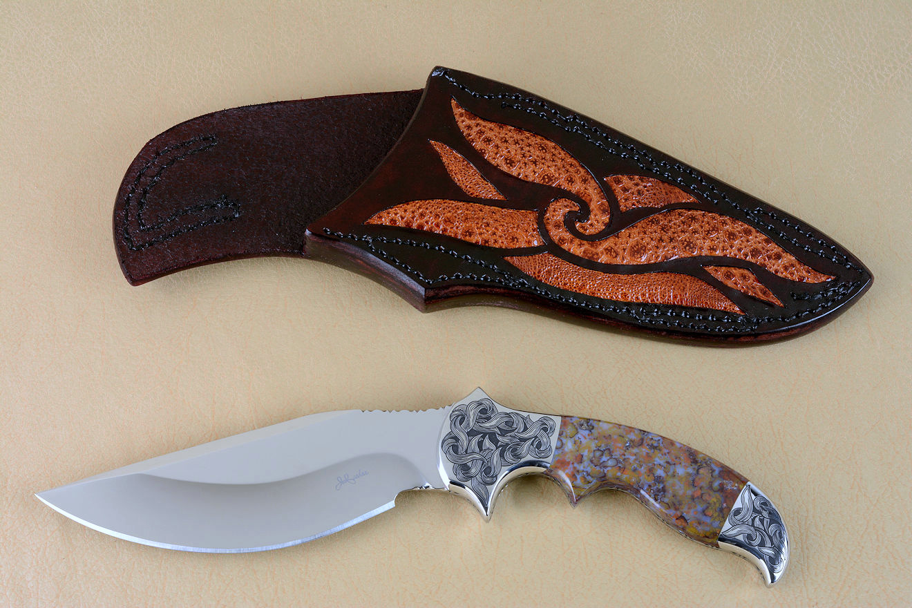 "Orion" obverse side view in 440C high chromium stainless steel blade, hand-engraved 304 stainless steel bolsters, Rio Grande Agate gemstone  handle, hand-carved leather sheath inlaid with frog skin