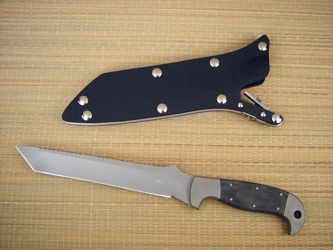 "PJ" Pararescue style tactical knife, obverse side view in 440C high chromium stainless steel blade, 304 stainless steel bolsters, canvas micarta phenolic handle, locking kydex, aluminum, stainless steel sheath