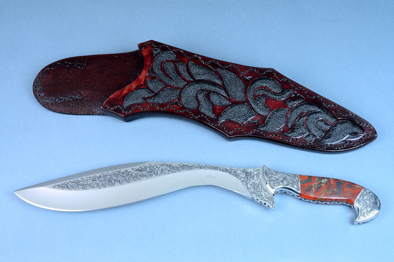 "Pallene" obverse side view in CPM154CM high molybdenum powder metal technology tool steel blade, hand engraved, with hand-engraved 304 stainless steel bolsters, Brecciated Jasper gemstone handle, and a sheath of hand-carved leather inlaid with rayskin