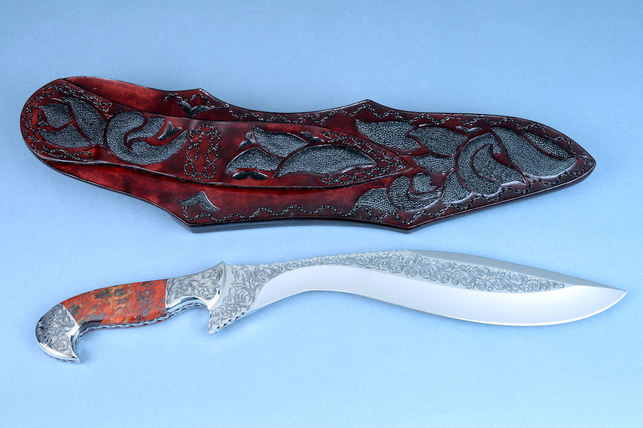 "Pallene" reverse side view, in CPM154CM high molybdenum stainless steel blade, hardend and tempered and cryogencially treated to 62 HRC, fully engraved, with stainless steel fittings, gemstone handle, and hand-carved leather sheath inlaid with rayskin