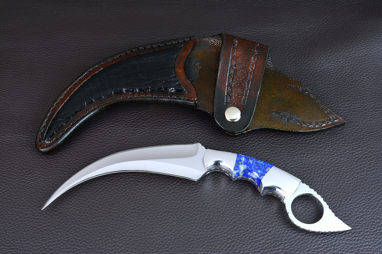 "Raptor" reverse side view in CPM154CM powder metal technology high molybdenum stainless steel blade, 304 stainless steel bolsters, Peruvian Lapis Lazuli gemstone handle, hand-carved leather sheath inlaid with Caiman skin
