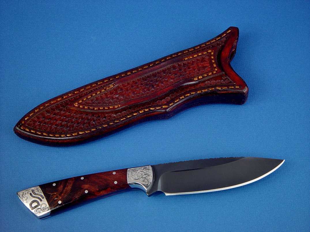 "Rio Grande" reverse side view in blued O1 high carbon tungsten-vanadium alloy tool steel blade, hand-engraved 304 stainless steel bolsters, Honduras Rosewood Burl hardwood handle, hand-stamped basket weave leather sheath