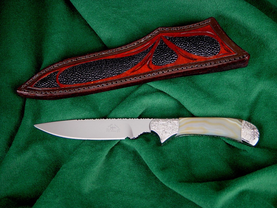 "Ruidoso" obverse side view in ATS-34 high molybdenum stainless steel blade, hand-engraved 304 stainless steel bolsters, Geodic agate gemstone handle, black stingray skin inlaid in hand-carved leather sheath 