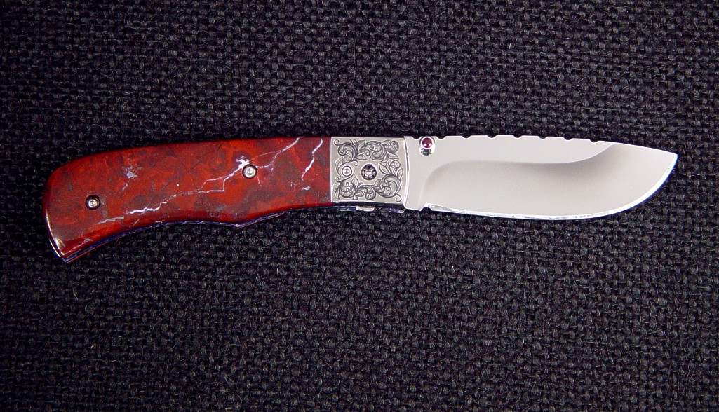 "Sadr" liner lock folding knife: 440C high chromium stainless steel blade, hand-engraved 304 stainless steel bolsters, jasper gemstone handle, anodized titanium liners, granite case