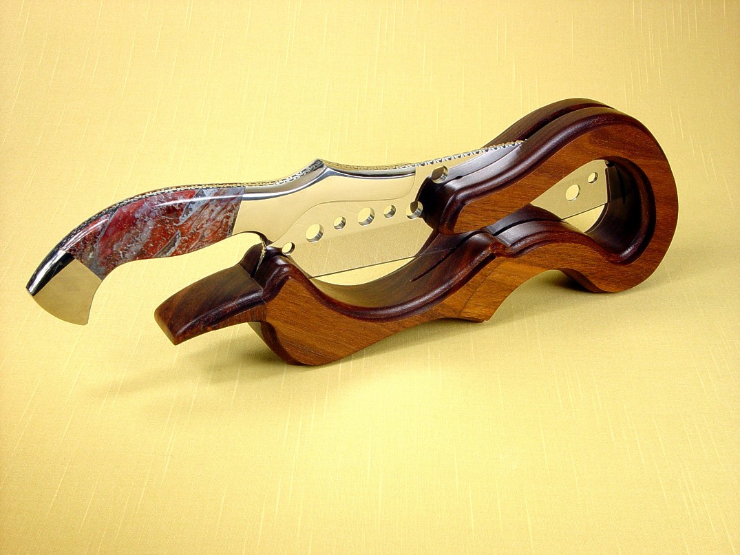 "Saussure" Master Chef's Knife in working, display stand. American Black Walnut is contoured, hand-finished in oils an waxes for a natural look. 
