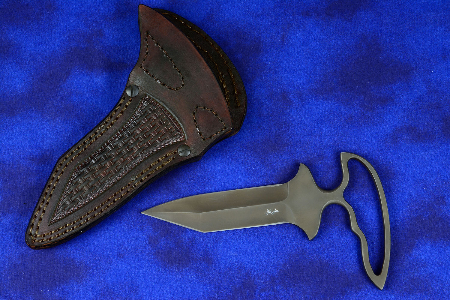 "Shrike" Custom  Push/Punch knife, obverse side view in T4 cryogenically treated CPM 154CM high molybdenum powder metal stainless steel blade, sheath in hand-tooled bison brown basketweave leather, nylon, stainless steel
