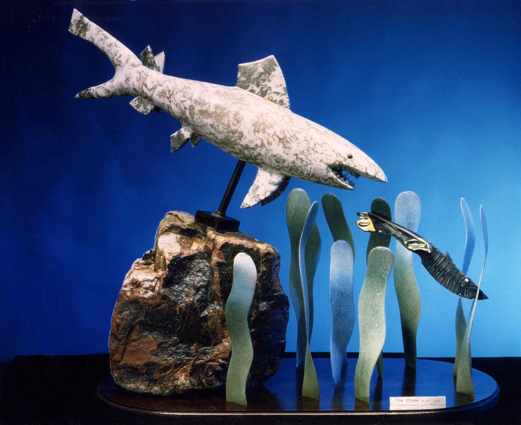 "The Chase" knife sculpture in multiple media, carved and polished stone, metals, with engraving. 