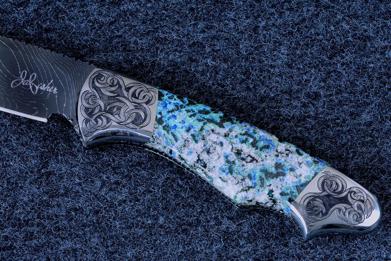 "Thuban" obverse side view in hot-blued 1095/nickel damascus blade, hand-engraved 304 stainless steel bolsters, Shattuckite gemstone handle, hand-carved, hand-dyed leather sheath