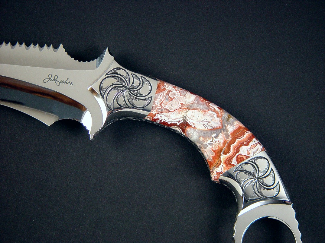 "Titan" kerambit, obverse side view in 440C high chromium stainless steel blade, hand-engraved 304 stainless steel bolsters, Crazy Lace Agate gemstone handle, ostrich leg skin inlaid in hand-carved leather sheath